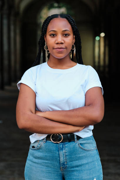 istock Young latin woman with braids looking directly at camera 1325702250
