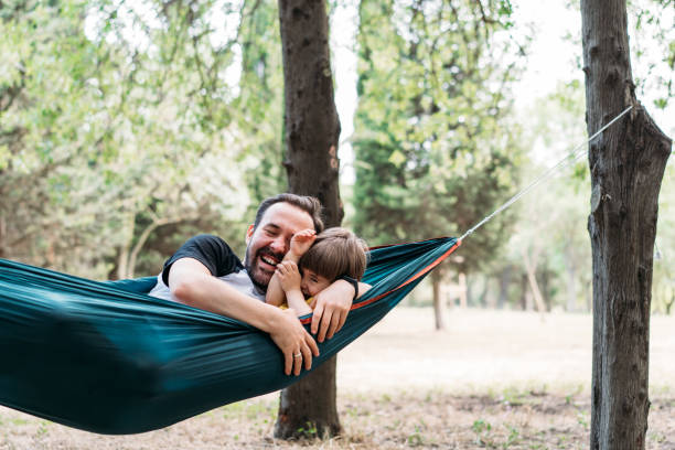 istock Father and his son having fun in the forest 1325706926