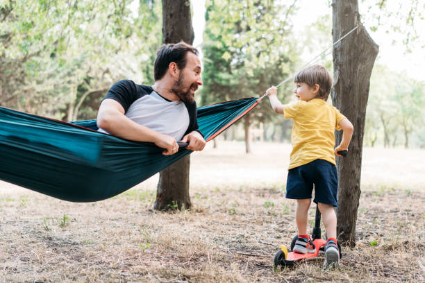 istock Father and his son having fun in the forest 1325707748