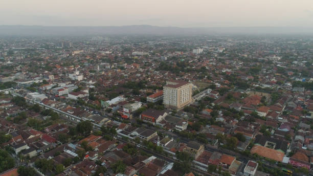 aerial view Yogyakarta, Indonesia cityscape Yogyakarta with buildings, highway at sunset time. aerial view cultural capital Indonesia yogyakarta located on java island, Indonesia yogyakarta stock pictures, royalty-free photos & images