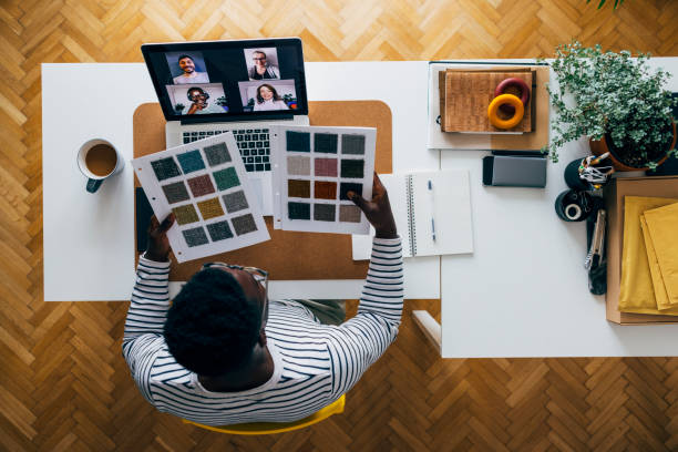 istock Work Frim Home: Young African American Choosing Colour Palette 1325708049