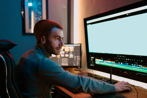 istock Male Video Editor Working on His Personal Computer with Big Display 1325708889