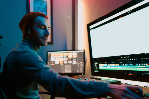 Male Video Editor Working on His Personal Computer with Big blank Display