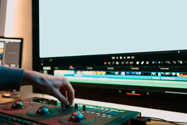 istock Male Video Editor Working on His Personal Computer with Big blank Display 1325708948