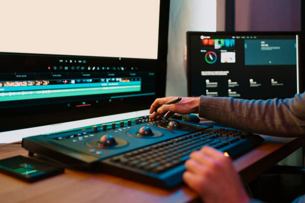 istock Male Video Editor Working on His Personal Computer with Big blank Display 1325708969