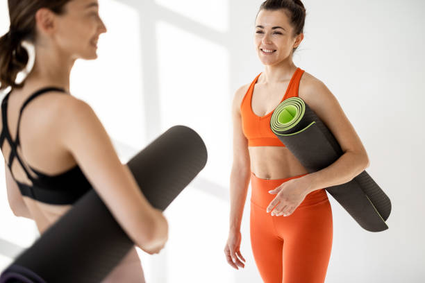 istock Two friends talk during the yoga break 1325708975