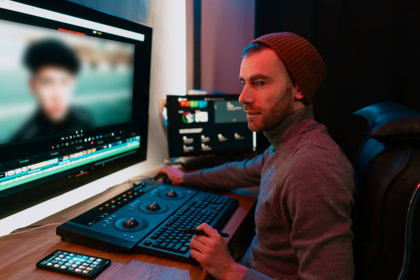 istock Male Video Editor Working on His Personal Computer with Big Display 1325709100