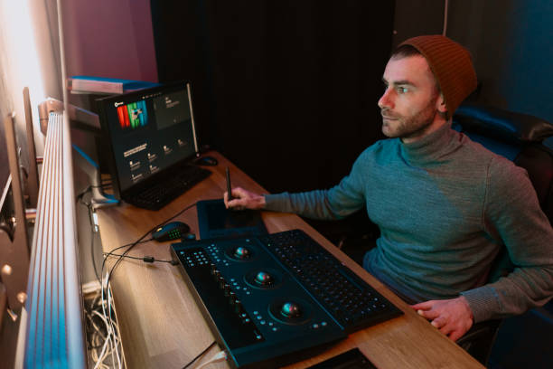 Male Video Editor Working on His Personal Computer with Big Display