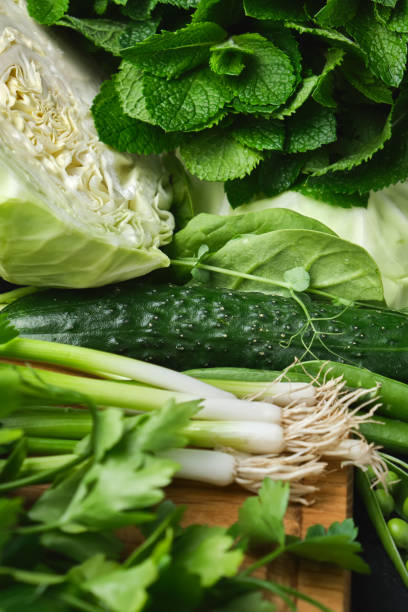 istock Close up Green vegetables, dark leafy food background. 1325710865