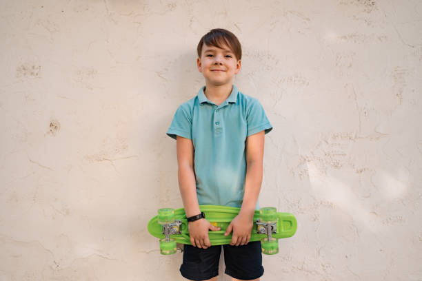istock A little boy holds a GREEN penny in his hands 1325711513