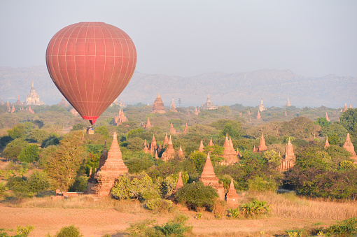 Scenic view of hot air balloon launching from the meadow in Laos