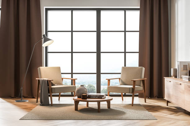 istock Light living room interior with armchairs and coffee table, panoramic windows 1325716932