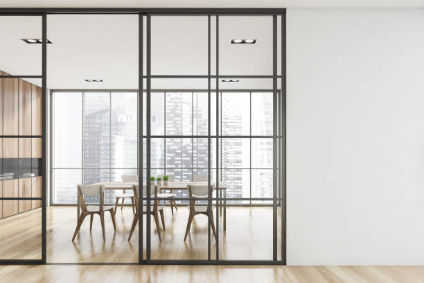 istock Interior design of modern meeting room with panoramic windows. Contemporary conference board table. Cityscape view. Mock up white copy space wall. 1325716944