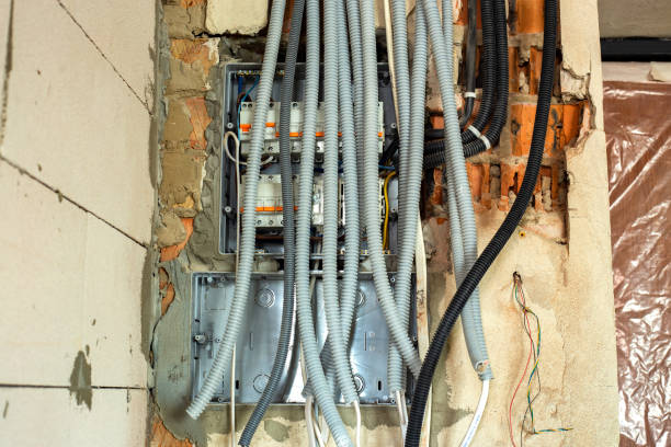 istock Electrical cables laid in protective corrugation installed on the ceiling and wall in a room under construction works. 1325718445