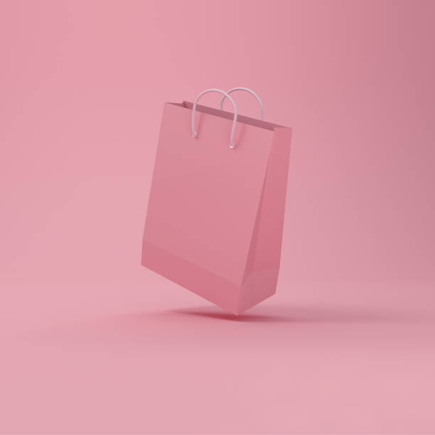 istock Shopping bag levitating in pink background. 1325718619