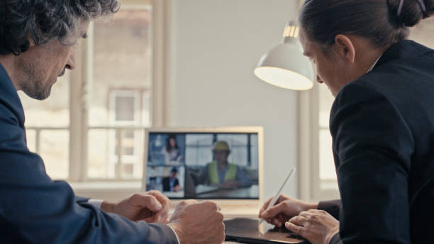 istock Virtual business meeting with multi-screen teleconference online. Colleagues working distantly while COVID-19 pandemic lockdown is on to flatten the curve. 1325718629