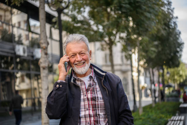 istock An Older Man is Talking in the City Streets and Having a Conversation Using his Smart Phone. 1325719595