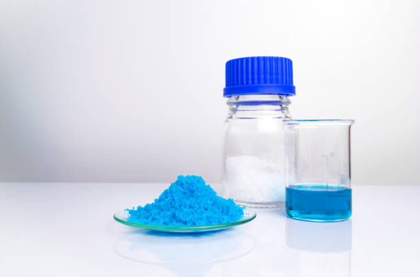 Inorganic chemical on white laboratory table. Microcrystalline wax, Copper(II) sulfate, alcohol. Chemical ingredient for Cosmetics and Toiletries product.