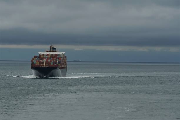 istock View on container vessel from other ship underway approaching the port of Vancouver, Canada 1325723330
