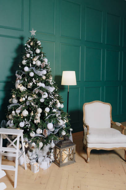 istock Christmas decor in a room with green walls 1325725877