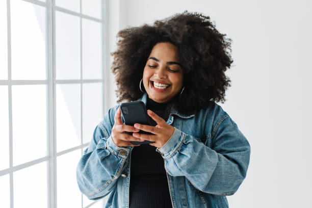 istock Beautiful woman using mobile phone 1325729265