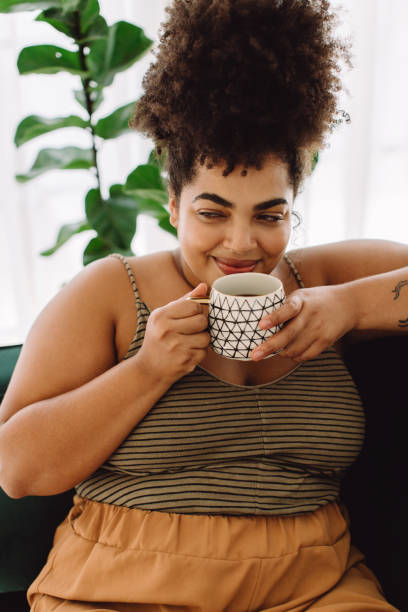 istock Woman drinking coffee at home 1325729273