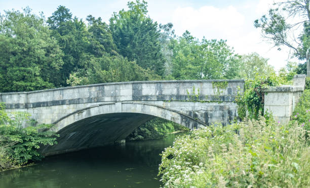 istock Ancient stone bridge over the River Test in Romsey, Hampshire 1325730218