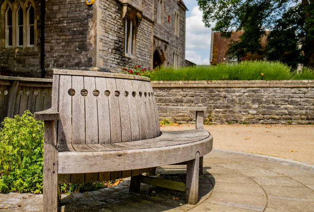 istock Wooden outdoor bench in a quiet courtyard 1325730240