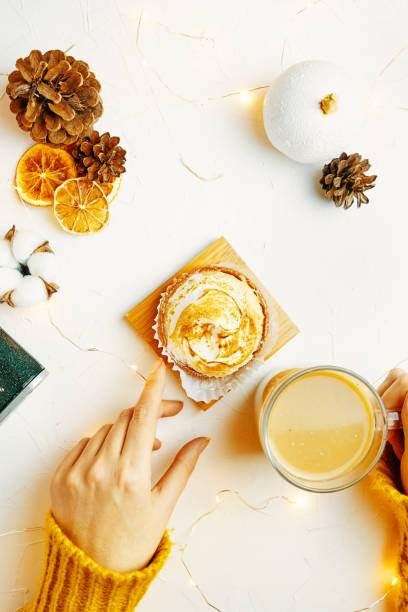 istock Top view of tartlet, coffee and decorations on white table. 1325730299