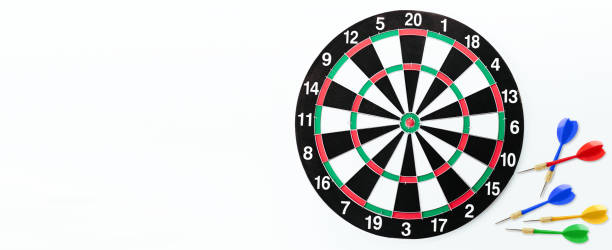 istock Dartboard and darts on white background with copy space. 1325730392