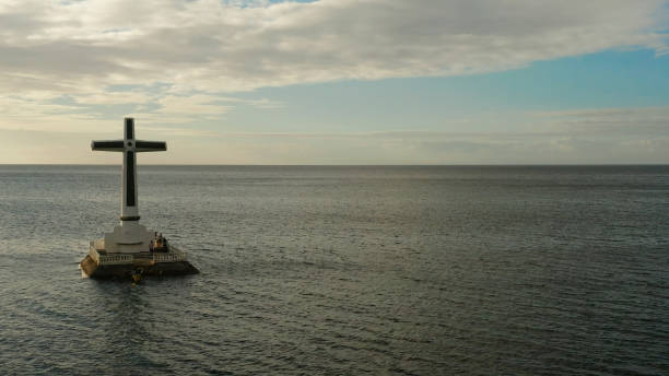 istock Sunken Cemetery cross in Camiguin island, Philippines 1325732140