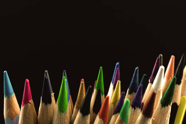 istock Macro studio shot of the color drawing pencils for creation, sharp tips close-up, black background with copy space photo 1325732467
