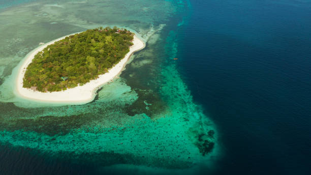istock Tropical island with sandy beach. Mantigue Island, Philippines 1325732510