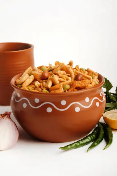 Photo of Indian Snacks, Bombay mix or namkeen, Chiwda or farsan is an Indian snack mix, popular tea-time food from India, delicious blend of sev, peanuts, peas and fried lentil.