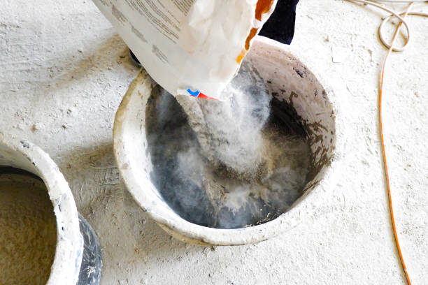 istock the builder pours the construction mixture into a container for guiding the mortar 1325739301