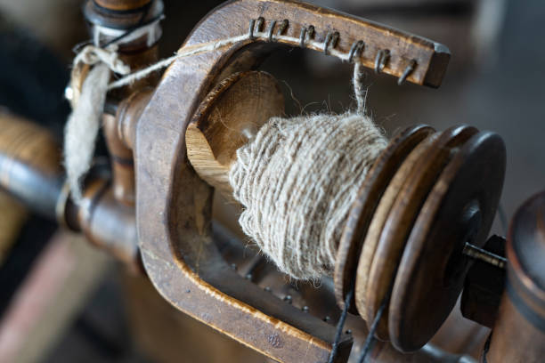 istock Thread in the Old spinning wheel. carpet making. close up 1325741137