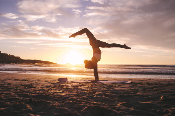 istock Fitness female practicing yoga at sunset 1325741339