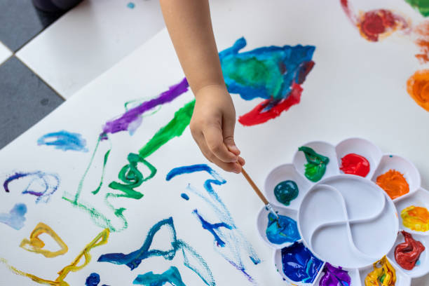 istock Child paint with watercolors. Education concept. 1325742532