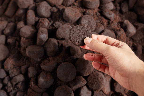 istock Unused coffee grounds with male hand. 1325743511