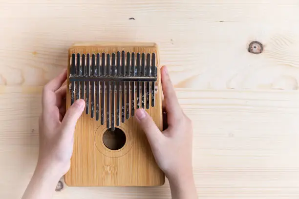 The Kalimba is a popular small wooden musical instrument that is light and easy to carry around as it doesn't require electricity.