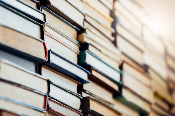 istock Background. Many old books and textbooks are in the library 1325743886