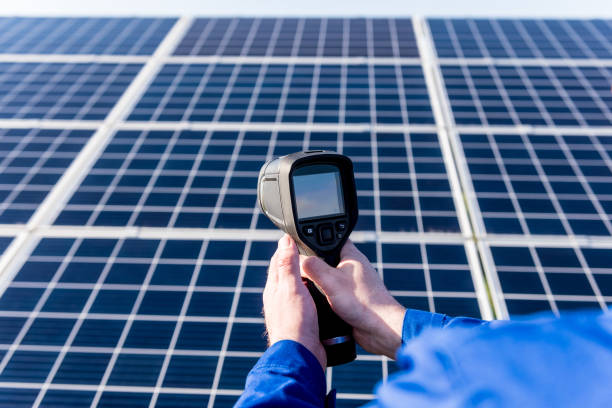 istock Inspector examination of photovoltaic modules using a thermal imaging camera 1325744038