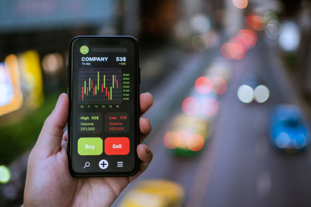 istock Businesswoman trader looking on smartphone with graphs analysis candle line. 1325745819