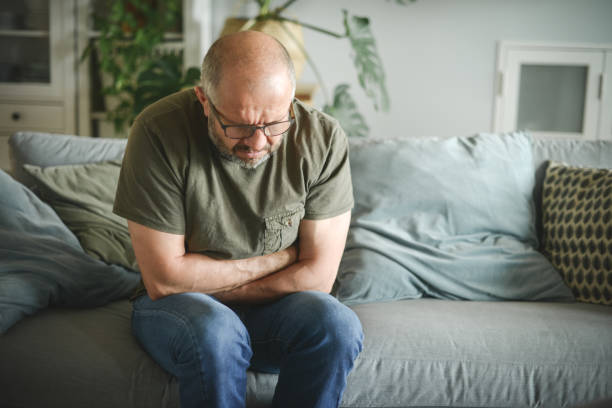 mature adult man ( illness, stomachache) mature adult man gastroesophageal reflux disease photos stock pictures, royalty-free photos & images