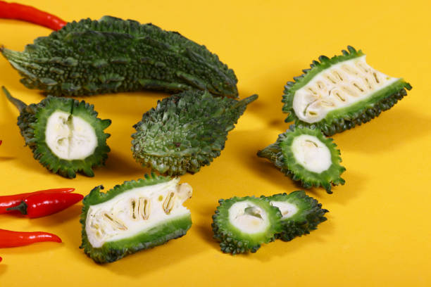 Karela Momordica charantia, commonly known as Karela, Spiny Gourd, Bitter Melon, Bitter Caigua, Chinese Cundeamor or balsam, a species of the family Cucurbitaceae widely cultivated in tropical and subtropical regions. High resolution 45Mp images using Canon EOS R5 and associate lenses pics of a spiky fruit stock pictures, royalty-free photos & images