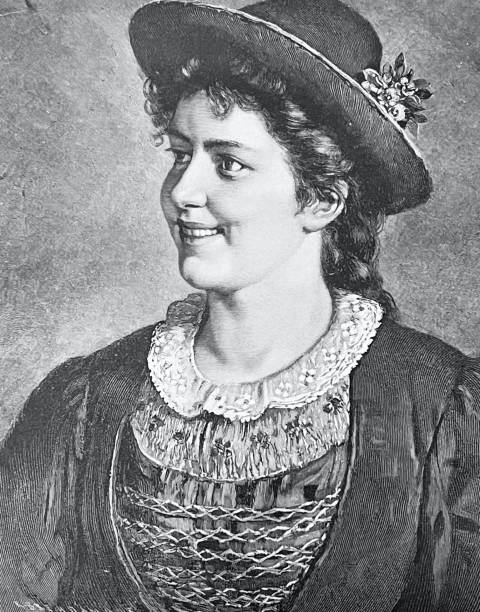 istock Portrait of a smiling young bavarian woman with hat, side view 1325747573