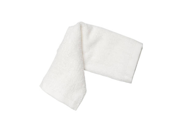 istock White fluffy cotton towel isolated on a white background. 1325750887
