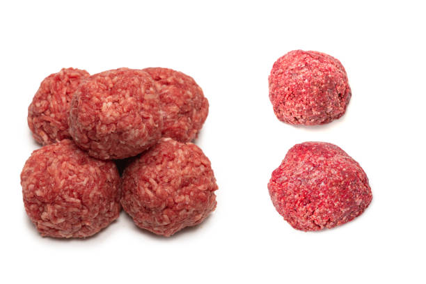 istock Raw meat balls isolated on white background. 1325750956