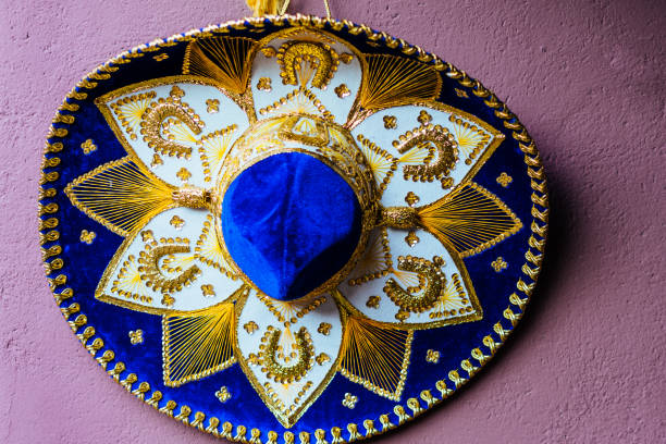 Blue and gold Mexican sombrero hanging on a wall