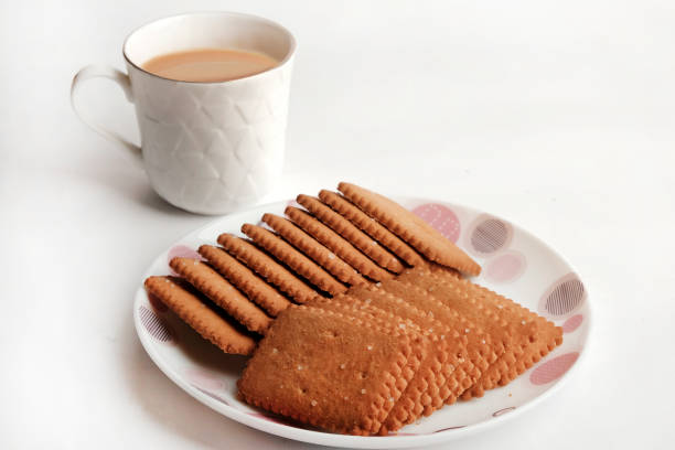 istock Wheat Coconut biscuits in white plate, Indian biscuits popularly known as Chai-biscuit in India, chai or chaha in india. Tea Time. 1325752849